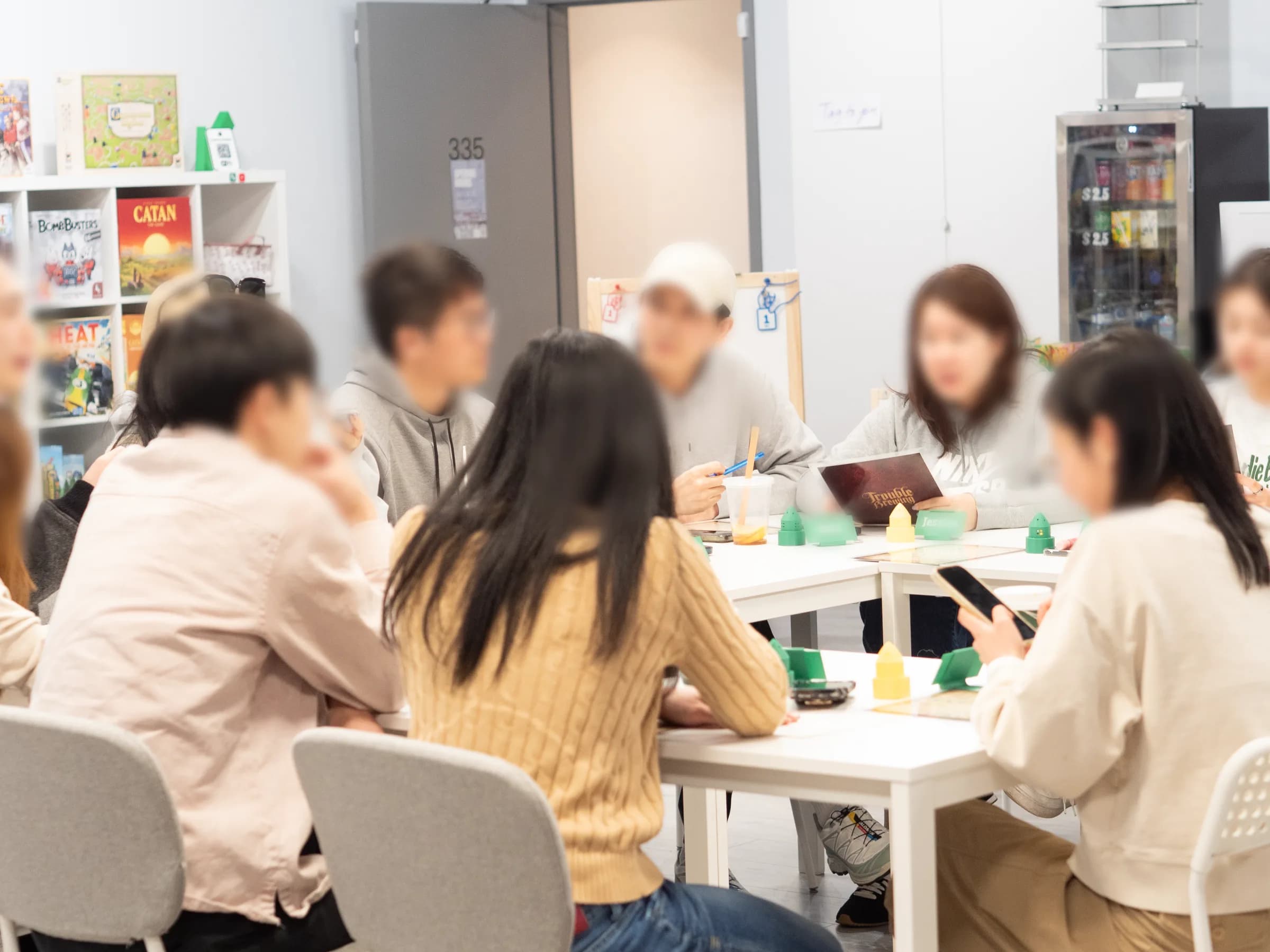 Players gathered around a social deduction game